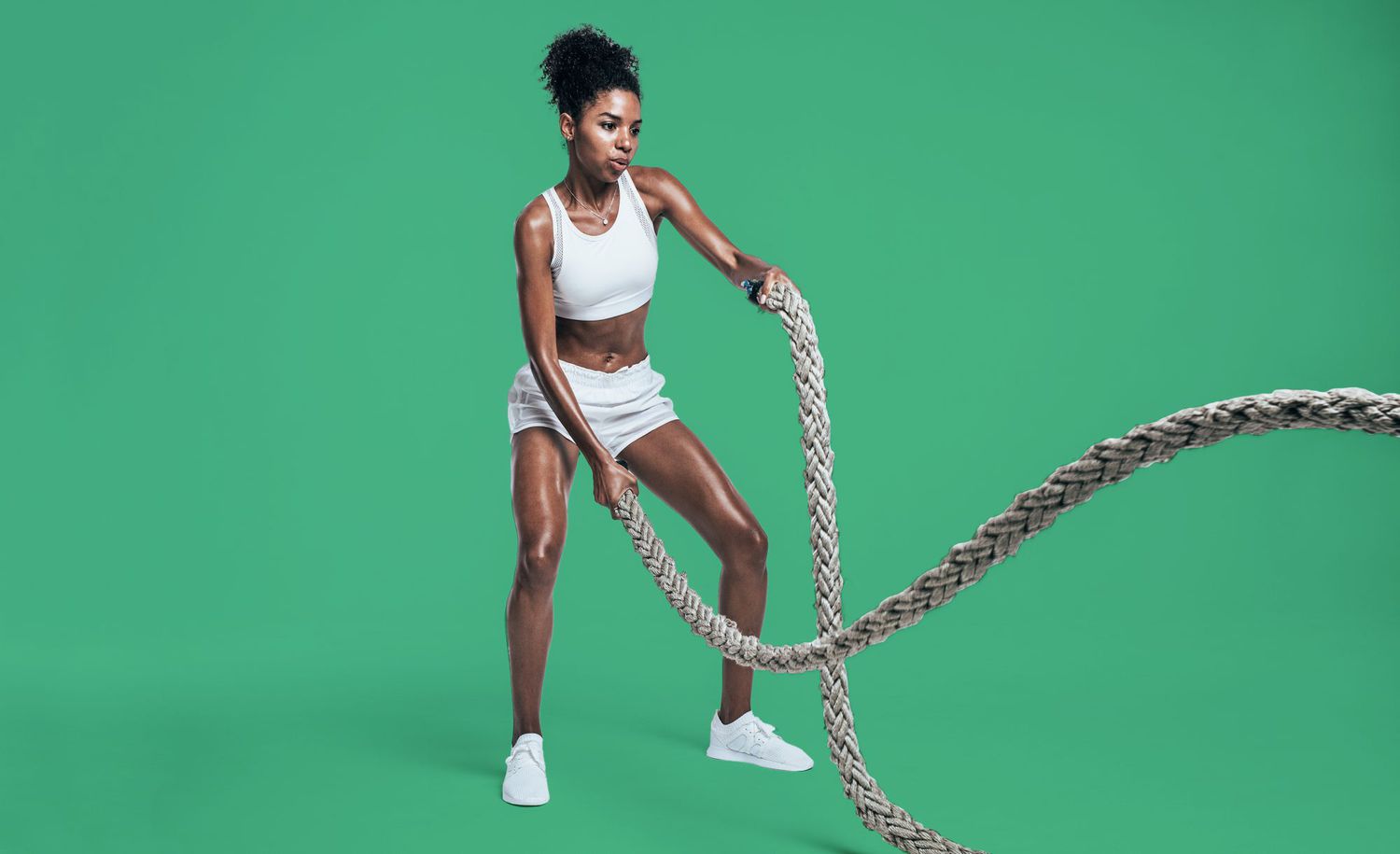 Athlete working out with battle ropes