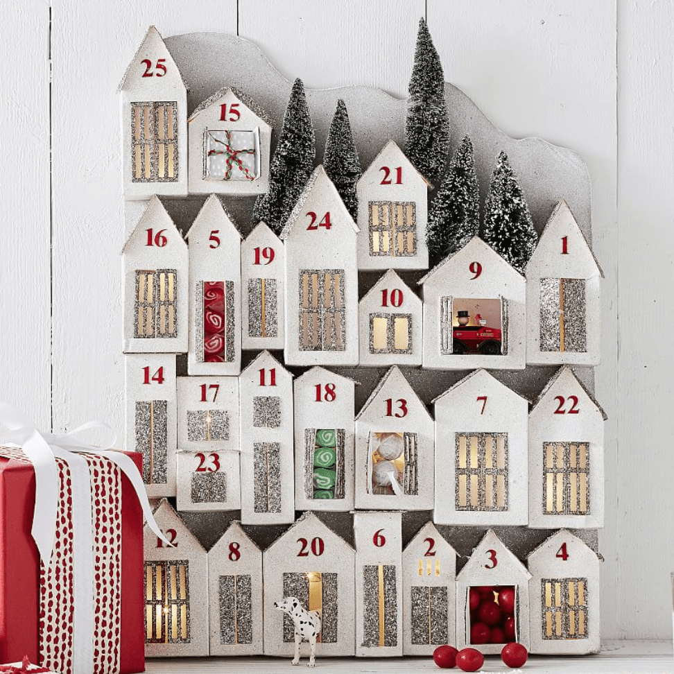 For the Family That's A Little Extra: Pottery Barn Light-Up Glitter Houses