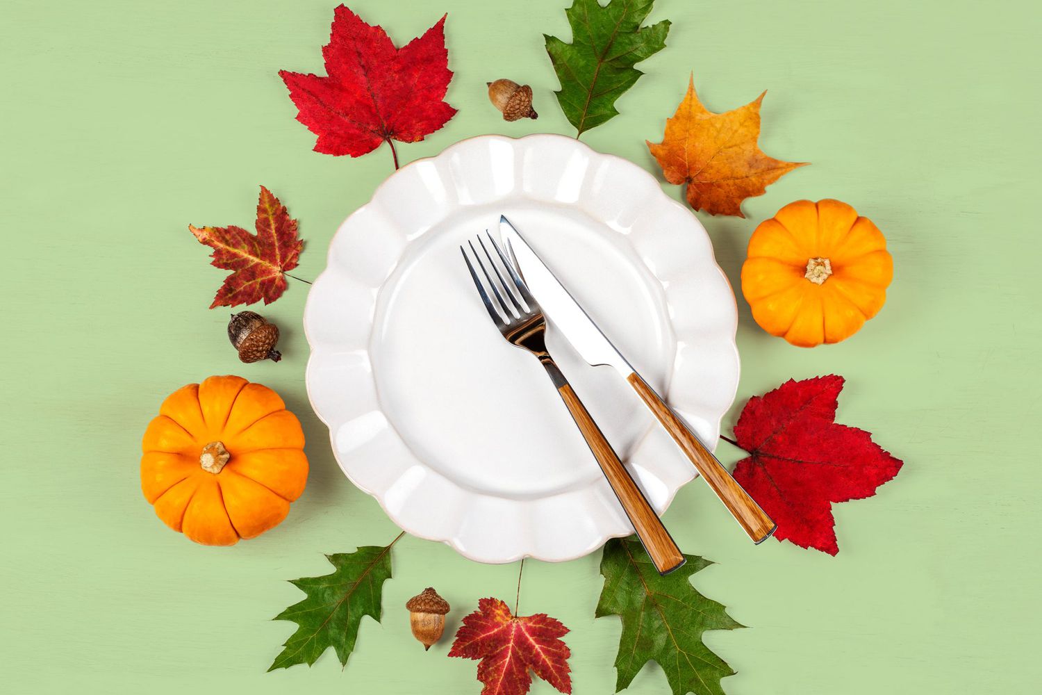 An empty Thanksgiving plate surrounded with leaves