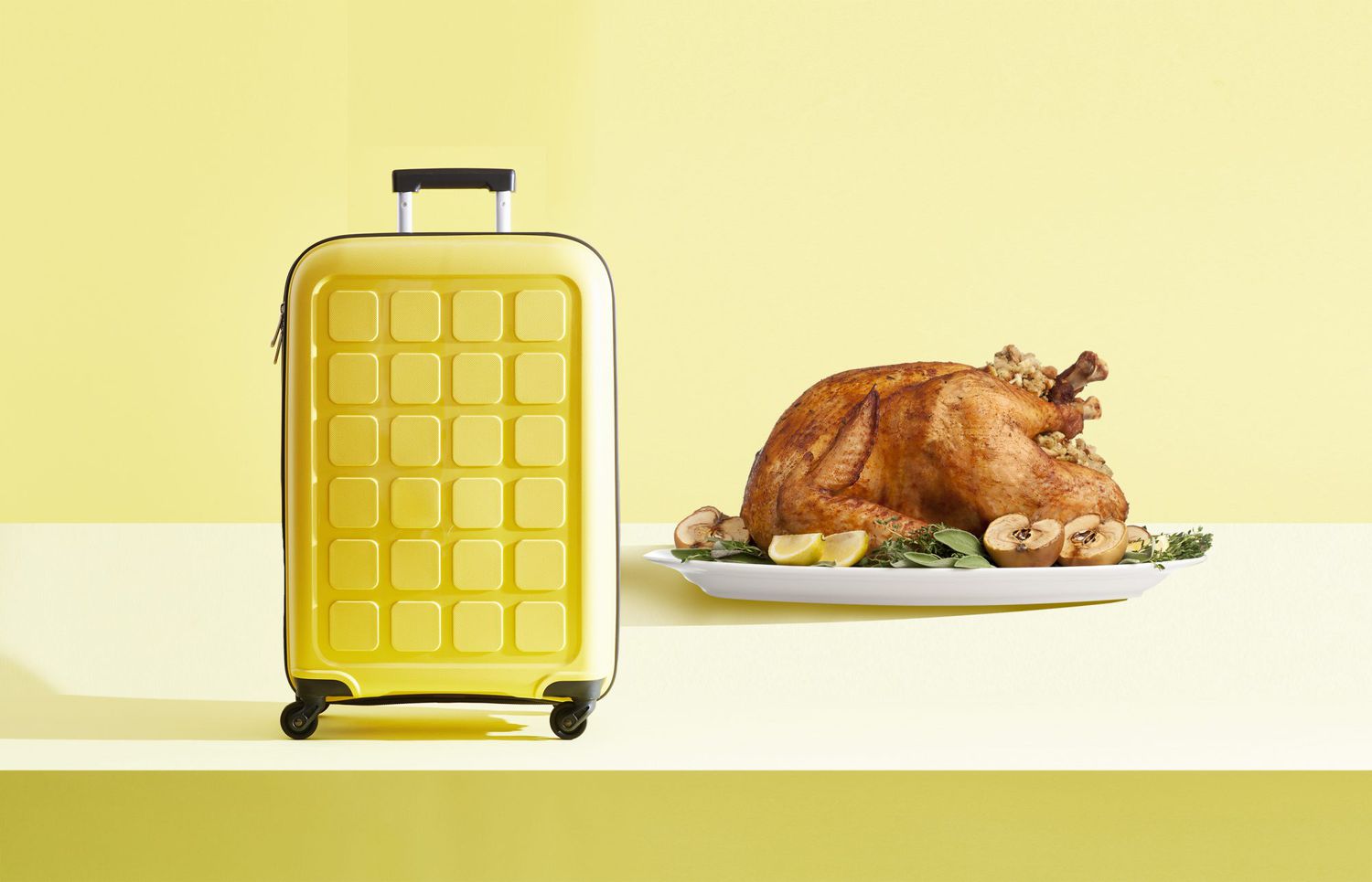 A yellow suitcase on a yellow background