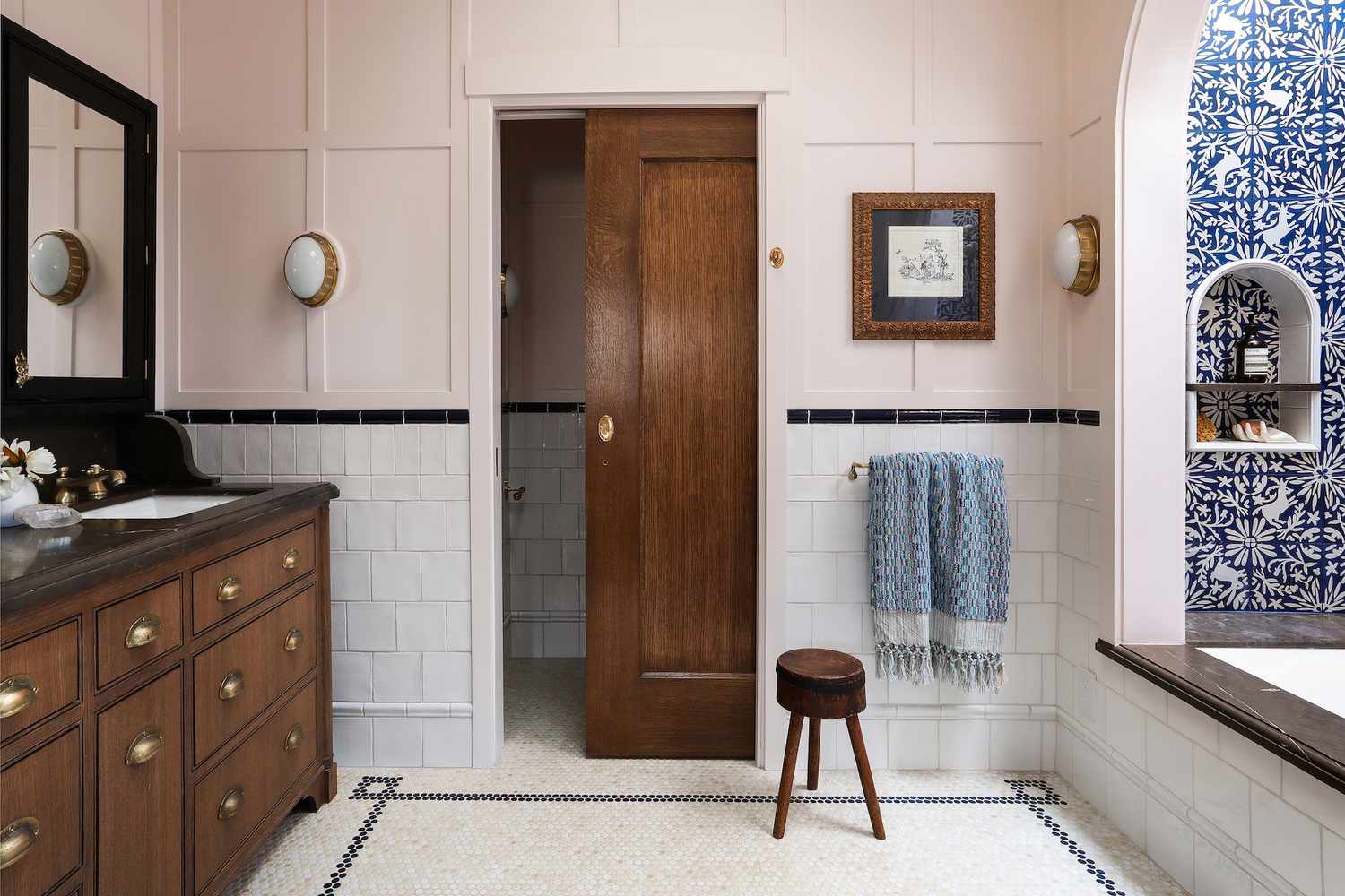 Bathroom Reveal by Landed Interiors, tile floor and light pink walls