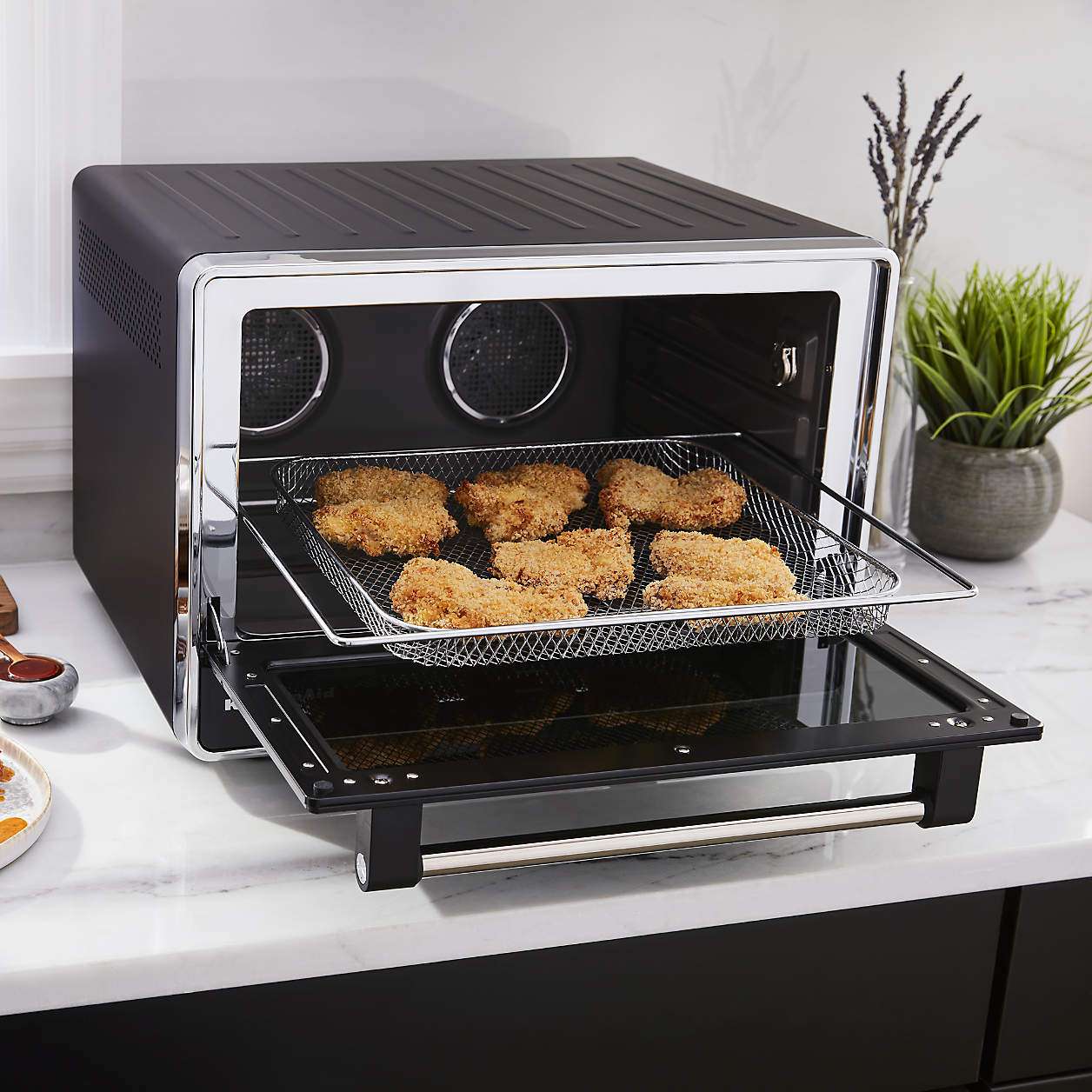 A KitchenAid convection oven and air fryer on a kitchen counter