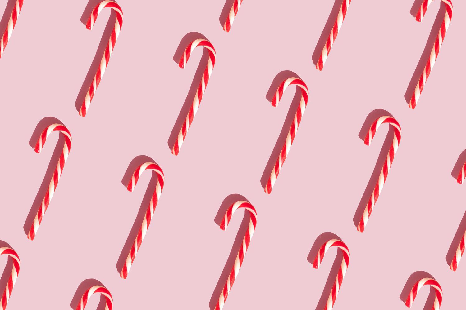 Candy canes on the pink background