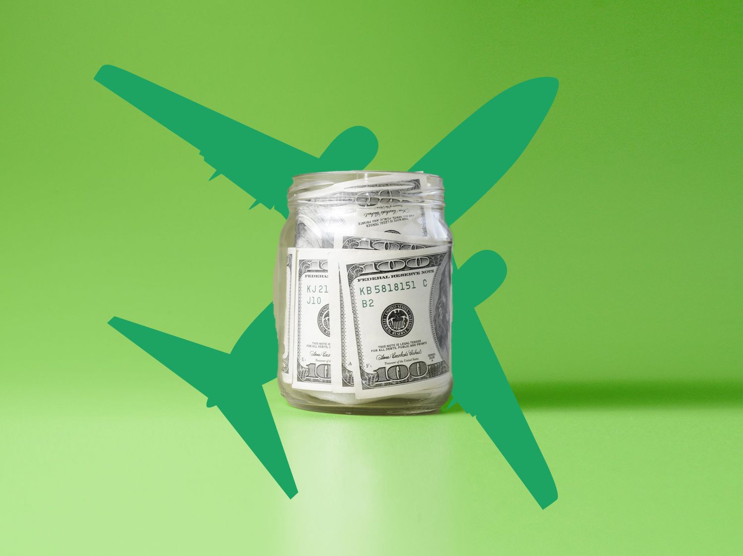 jar of hundred dollar bills on an airplane background