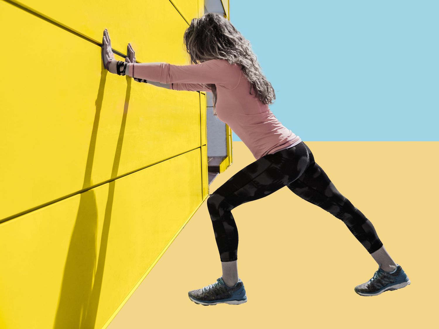 Streches for Knee Pain: woman stretching calf against a wall
