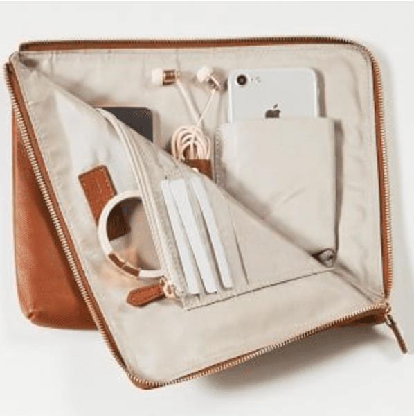 Camel-colored clutch with room for headphones, laptop, and more