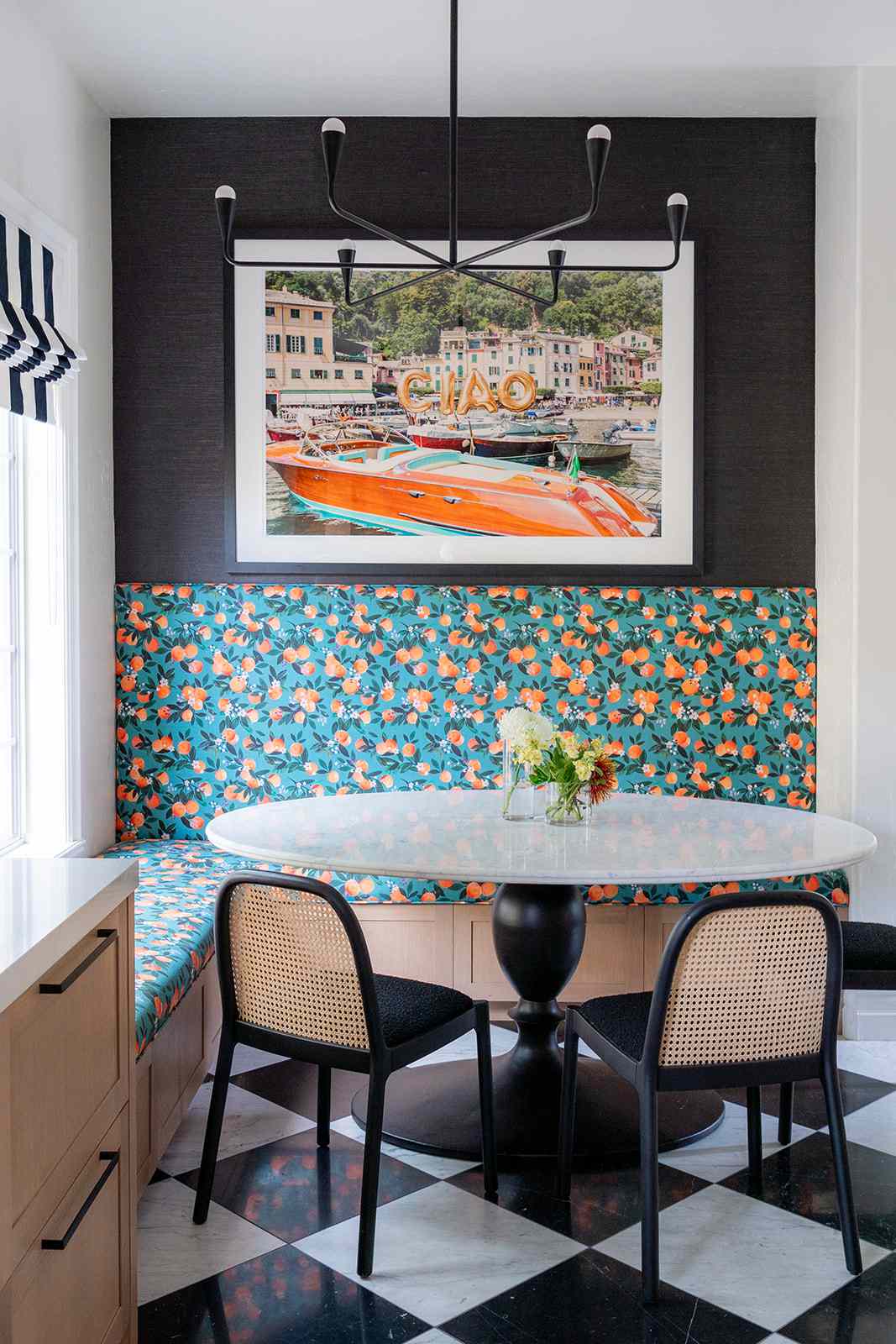 Patterned dining nook with cane chairs