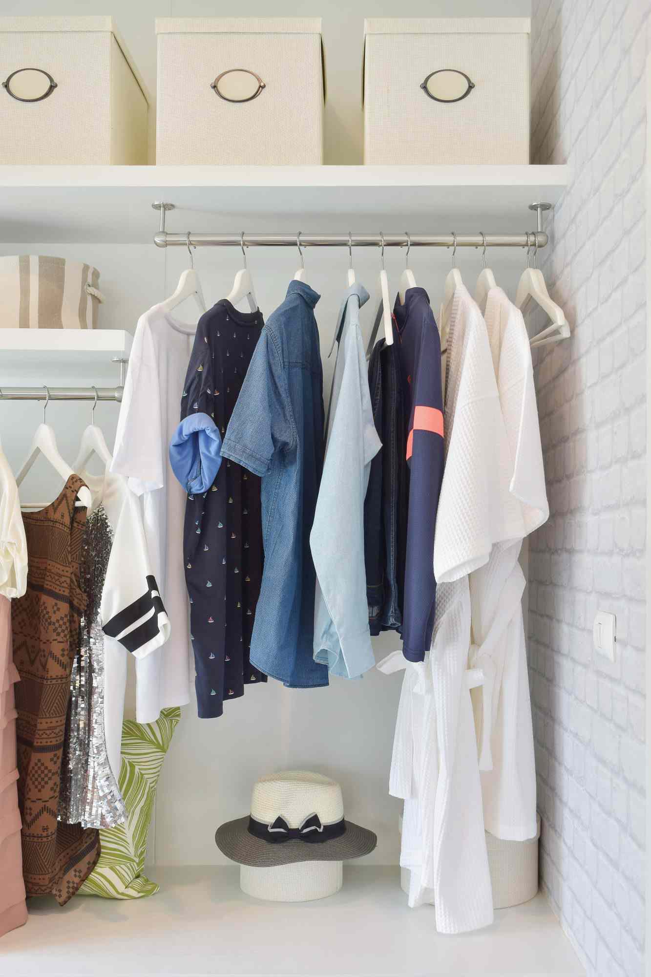 Clothes Hanging On Rack At Home in closet