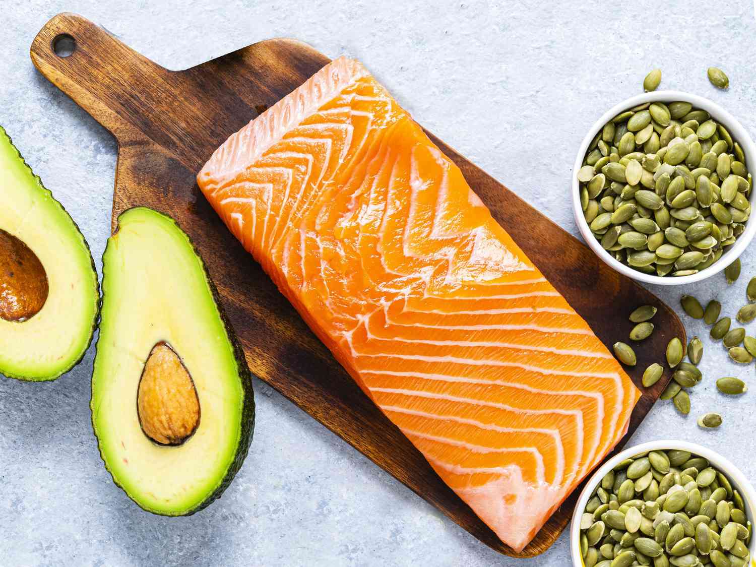 Foods high in magnesium: Avocado, salmon, pumpkin seeds