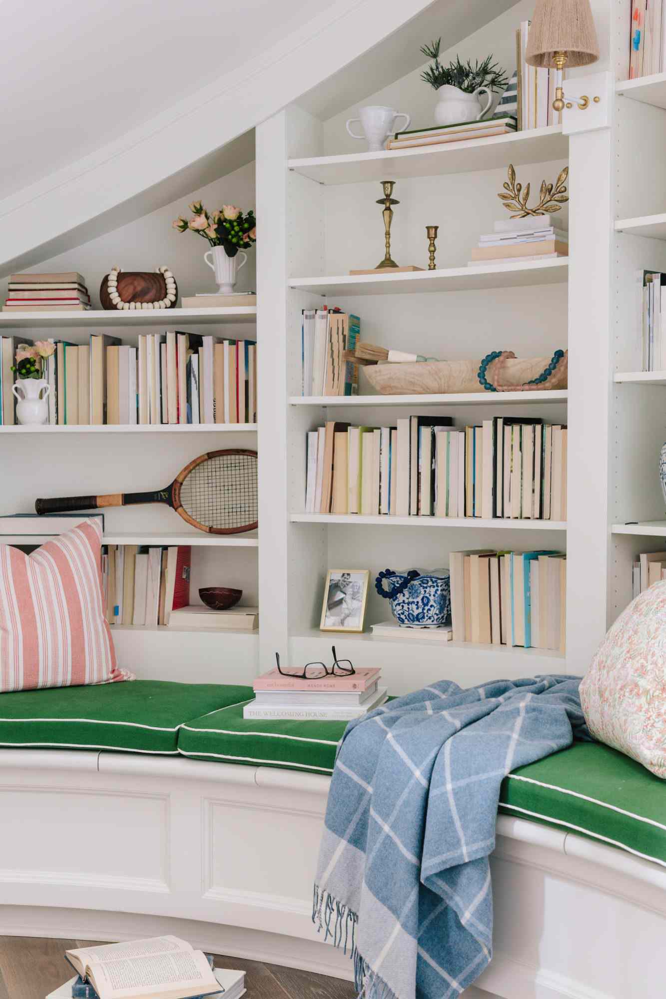 Close up of under stairs reading nook with bookcase