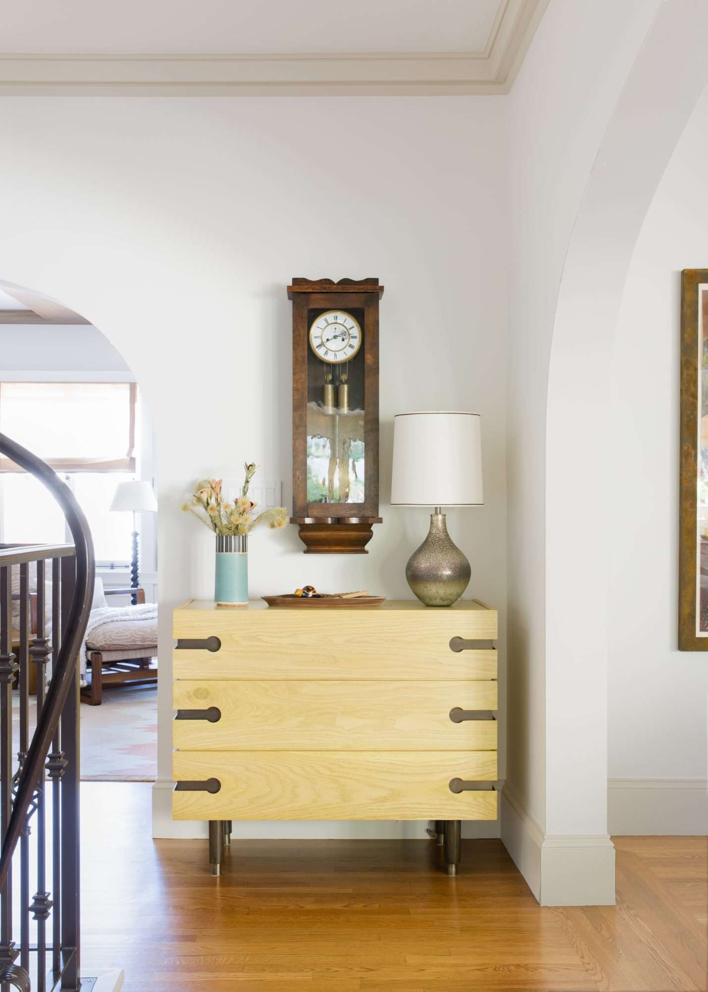 Wood and Brass Dresser at Top of Staircase