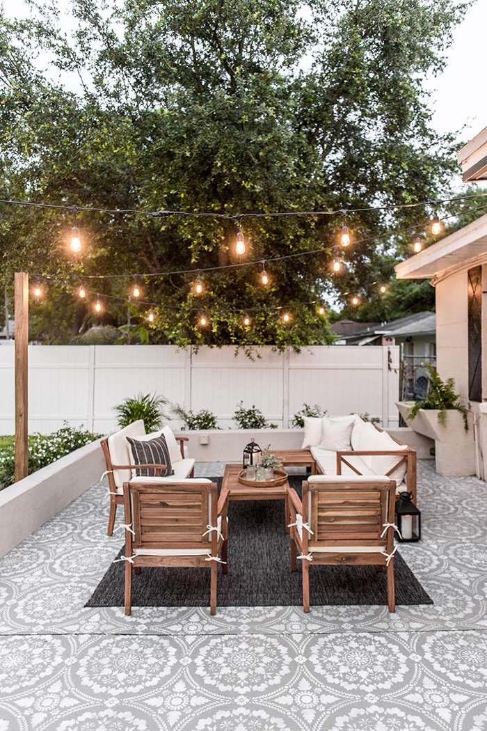 Painted Pattern Patio floor with string lights overhead and outdoor furniture