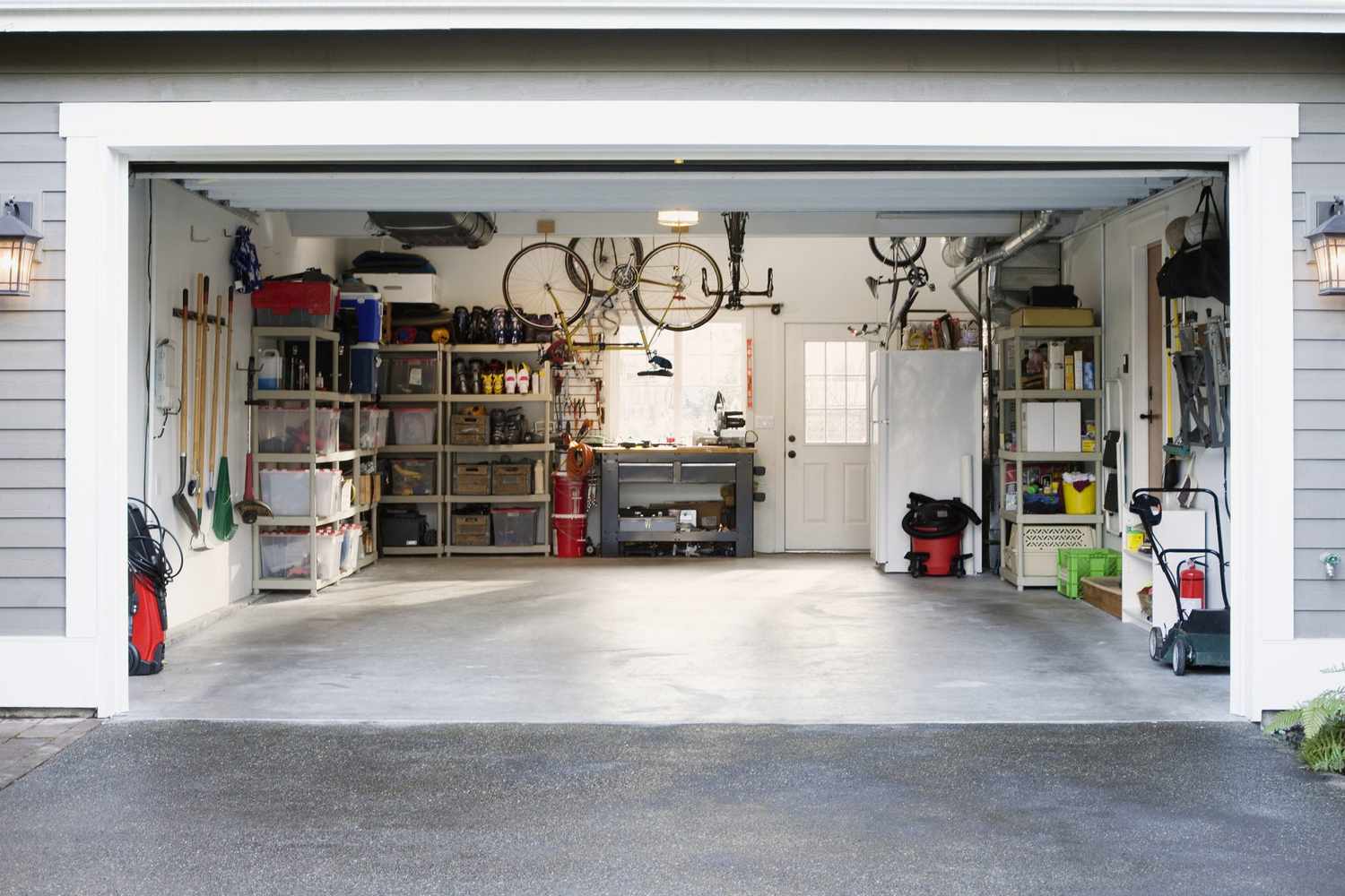 Organized garage with storage bins and bikes