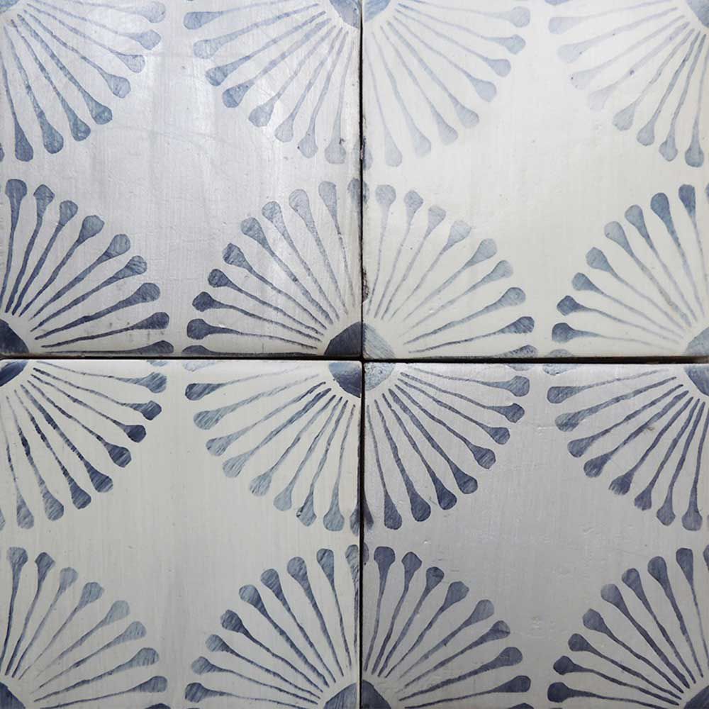 hand-painted tiles with blue circular pattern
