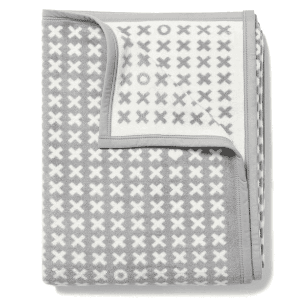 Gray and white blanket with x and o pattern