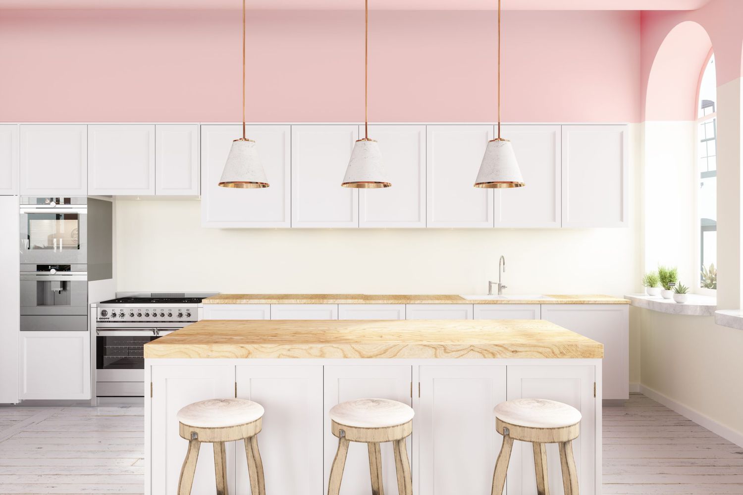 Pink Walled Kitchen With White Cabinets, Pendant Lights, Kitchen Island And Hardwood Floor