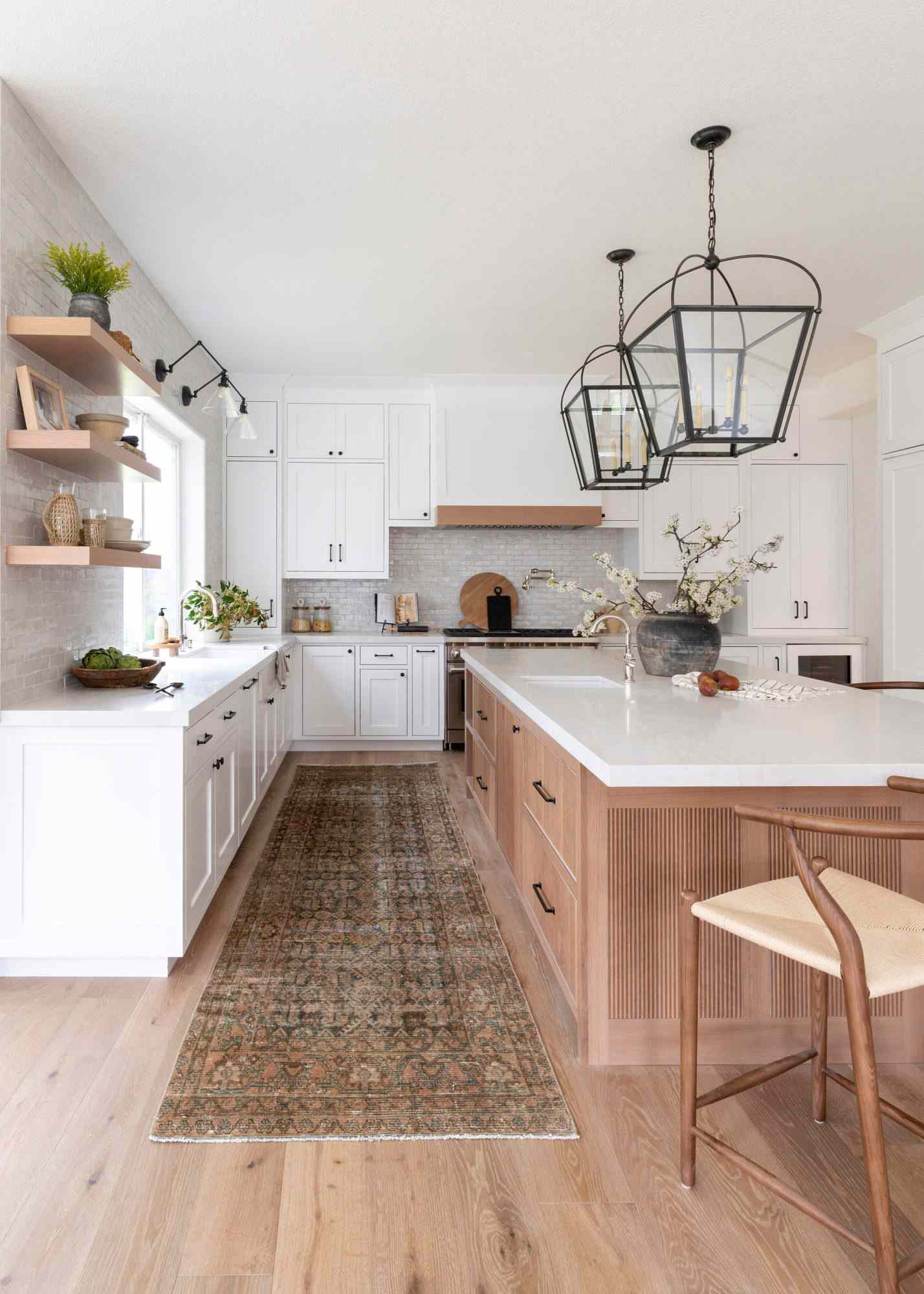 Kitchen with white cabinets and warm wood tones