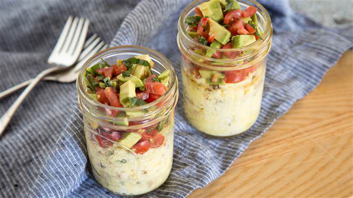 Bacon and Eggs in a Mason Jar topped with Avocado, Tomato & Basil