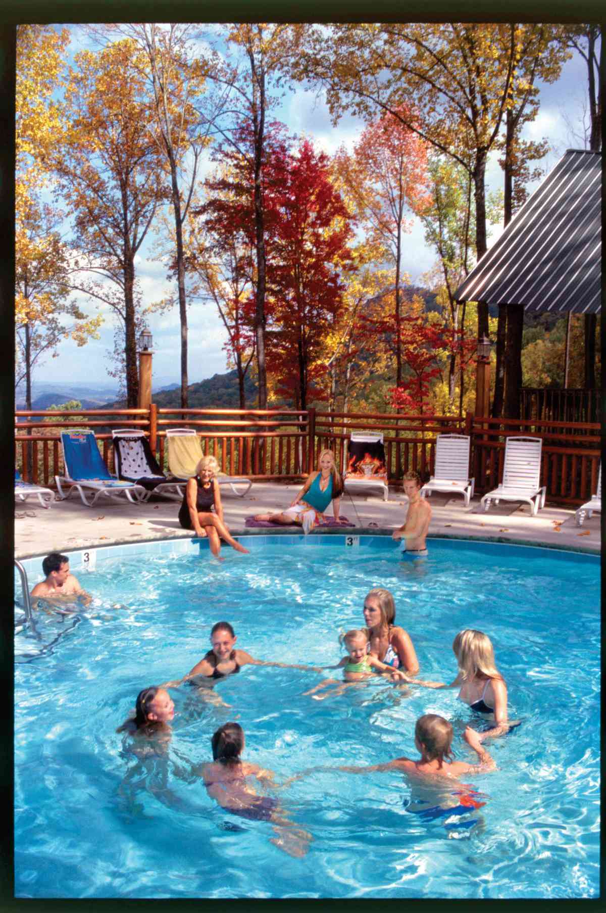 family in pool at smoky mountain cabin rental
