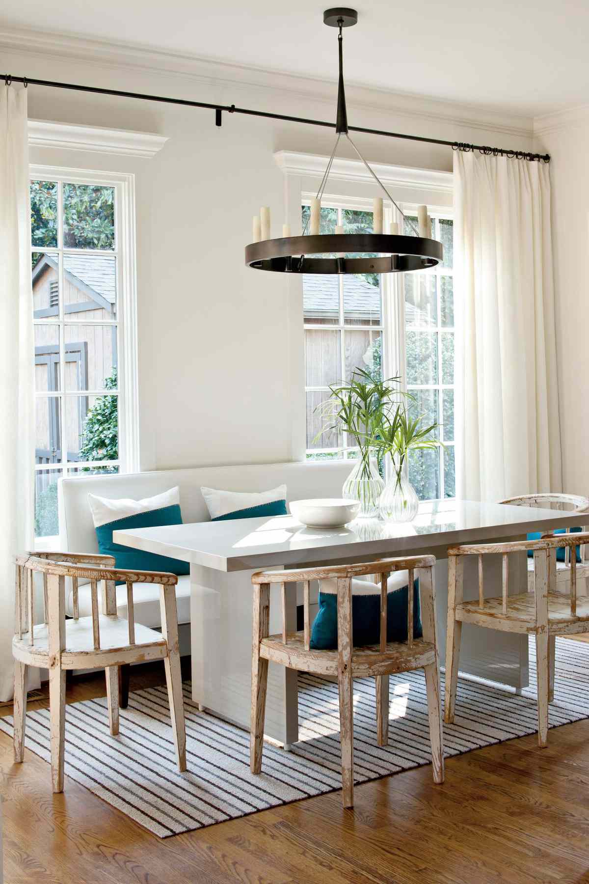 Airy Breakfast Room with Teal Accents