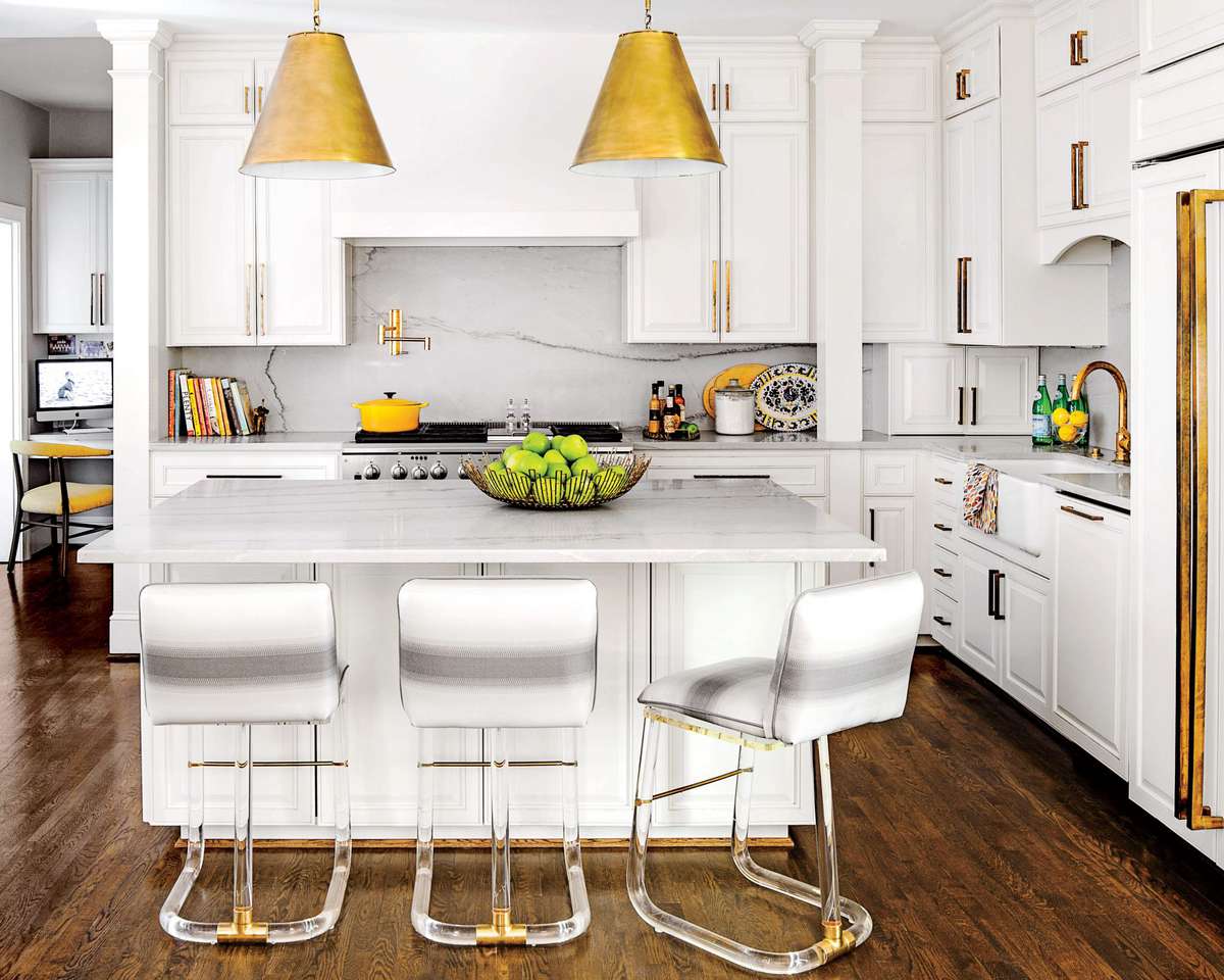 White Kitchen with Marble Countertops and Acrylic Stools