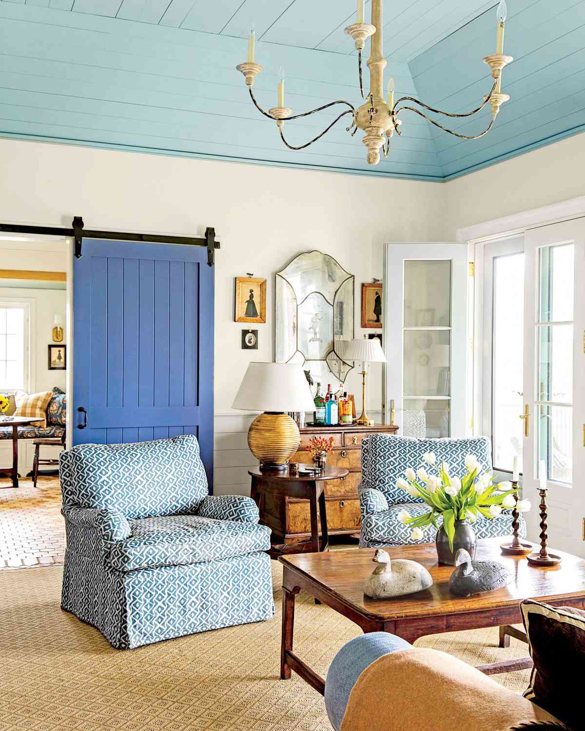 Living Room with Blue Barn Door
