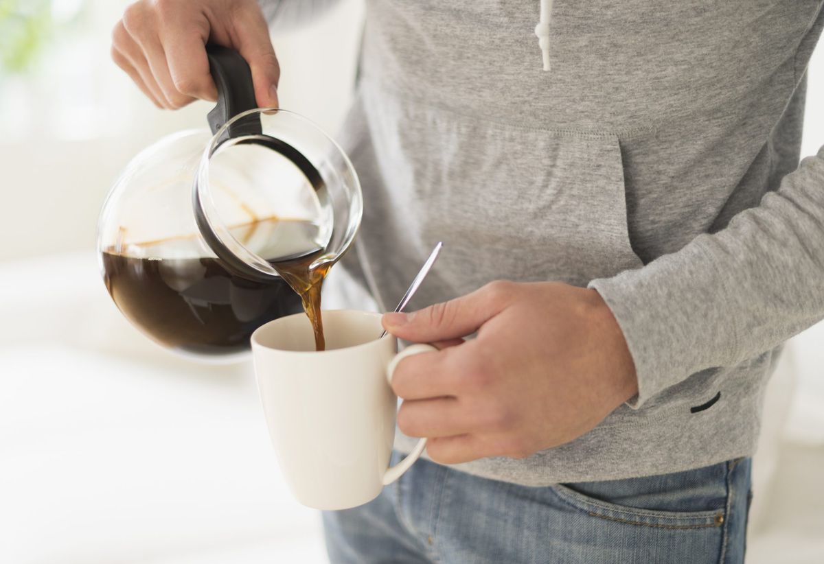 Man pouring coffee from coffeepot
