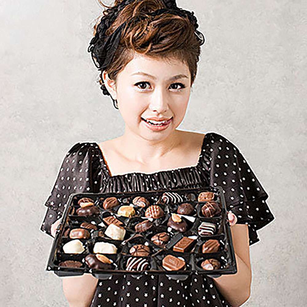 Woman Holding Box of Chocolates