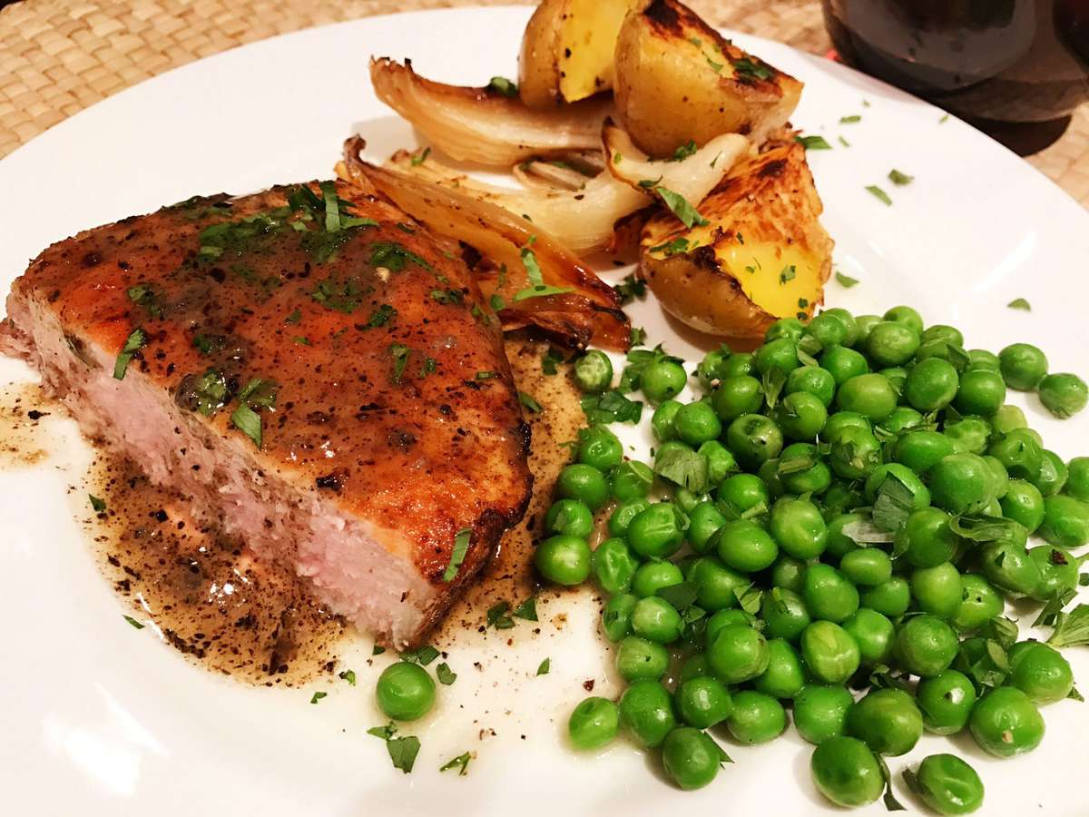 Fried Pork Chops with Peas and Potatoes