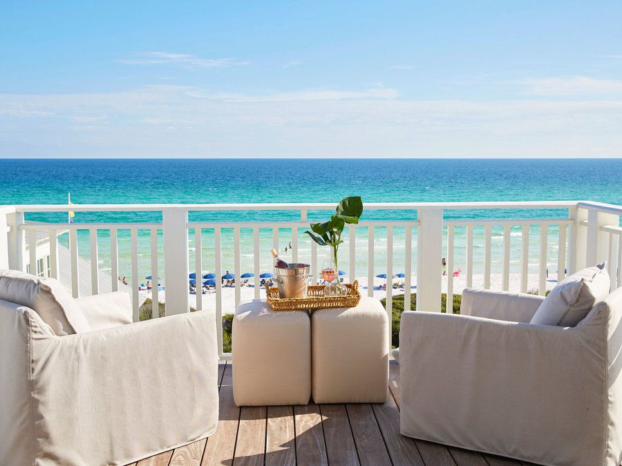 Two Lounge Chairs on the Deck Overlooking the Beach