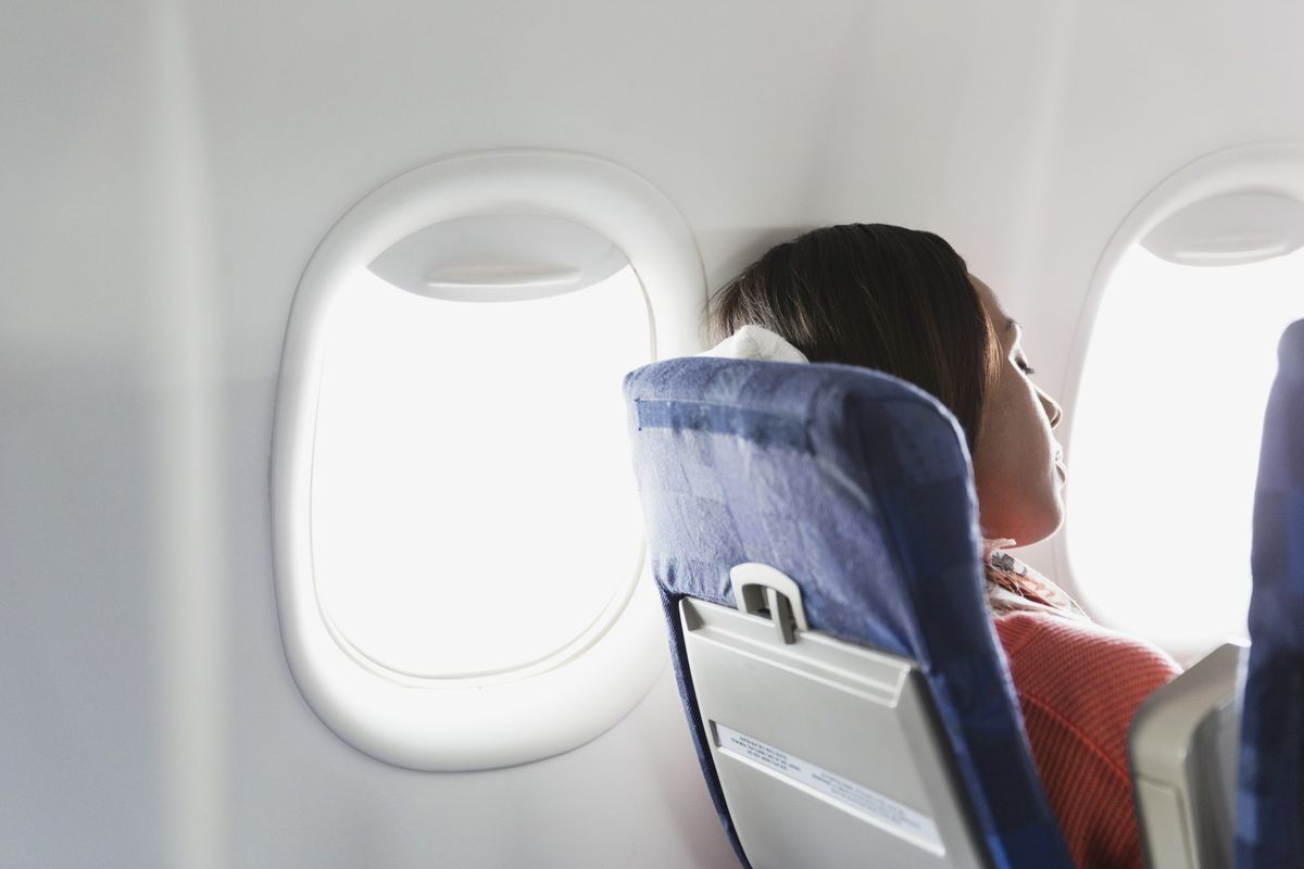 Woman Sleeping on Airplane
