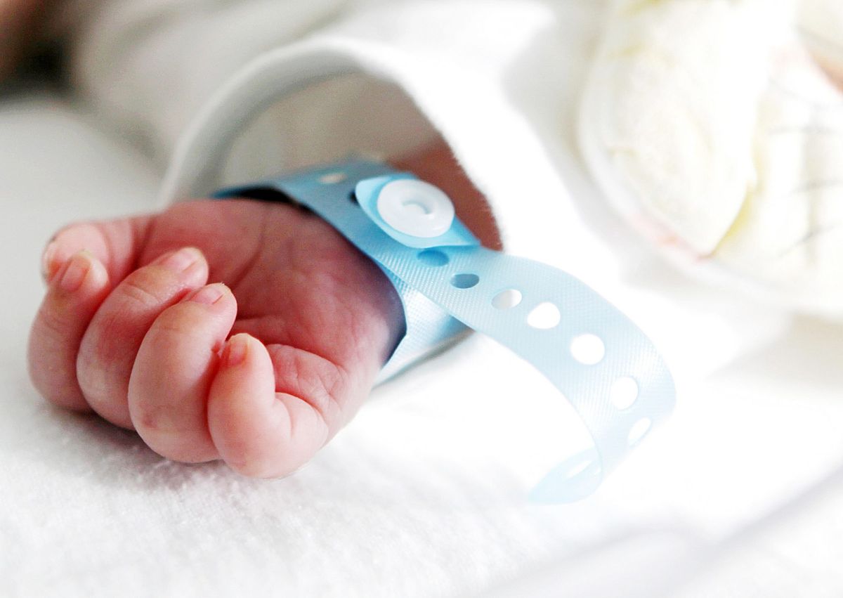 Infant baby wearing a hospital band