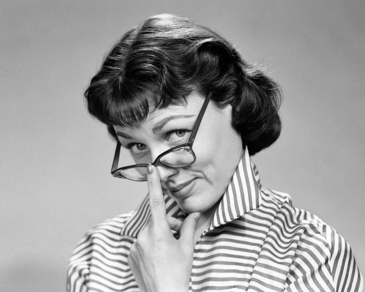 Woman Pushing Up Glasses