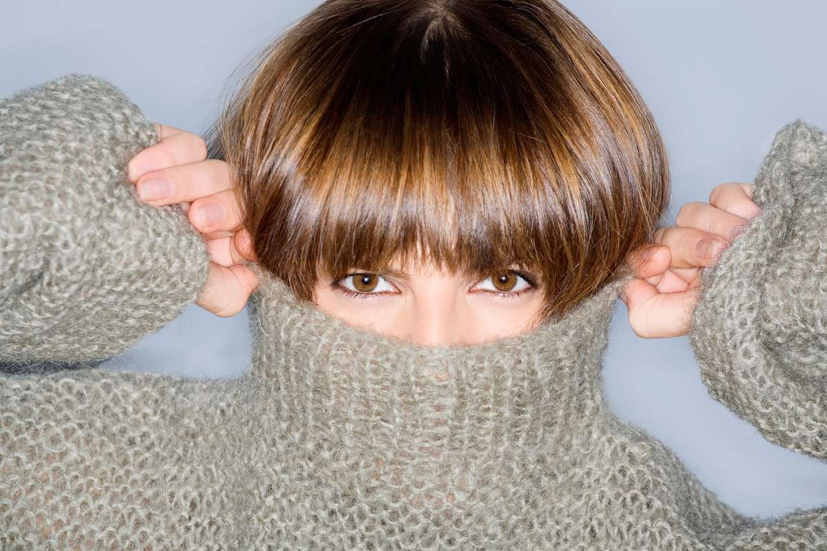 How to Tame Unruly Bangs This Winter