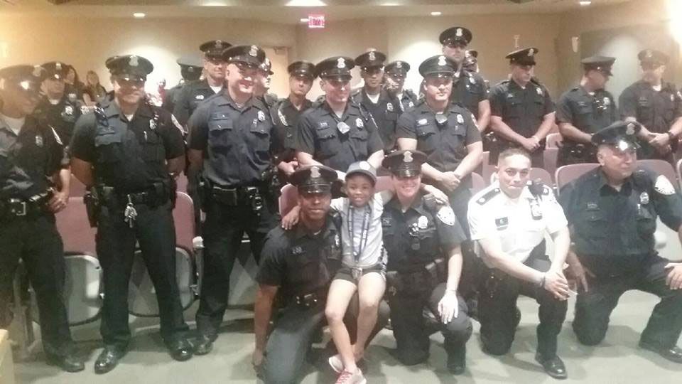 Rosalyn Baldwin Hugs Police Officers in Rhode Island