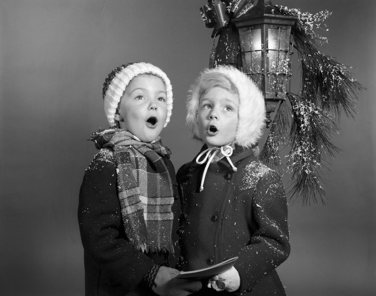 Vintage Boy and Girl Singing Christmas Carols