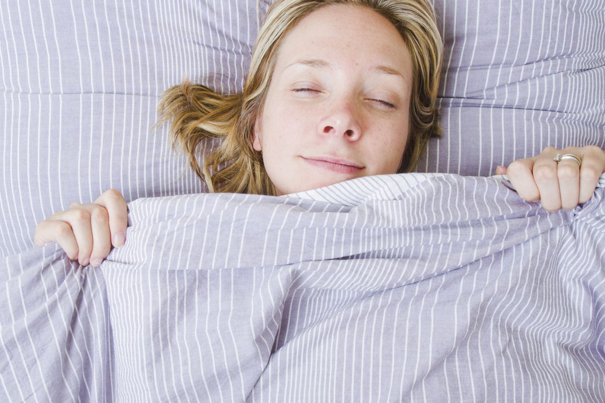Woman in Bed with Striped Bedding