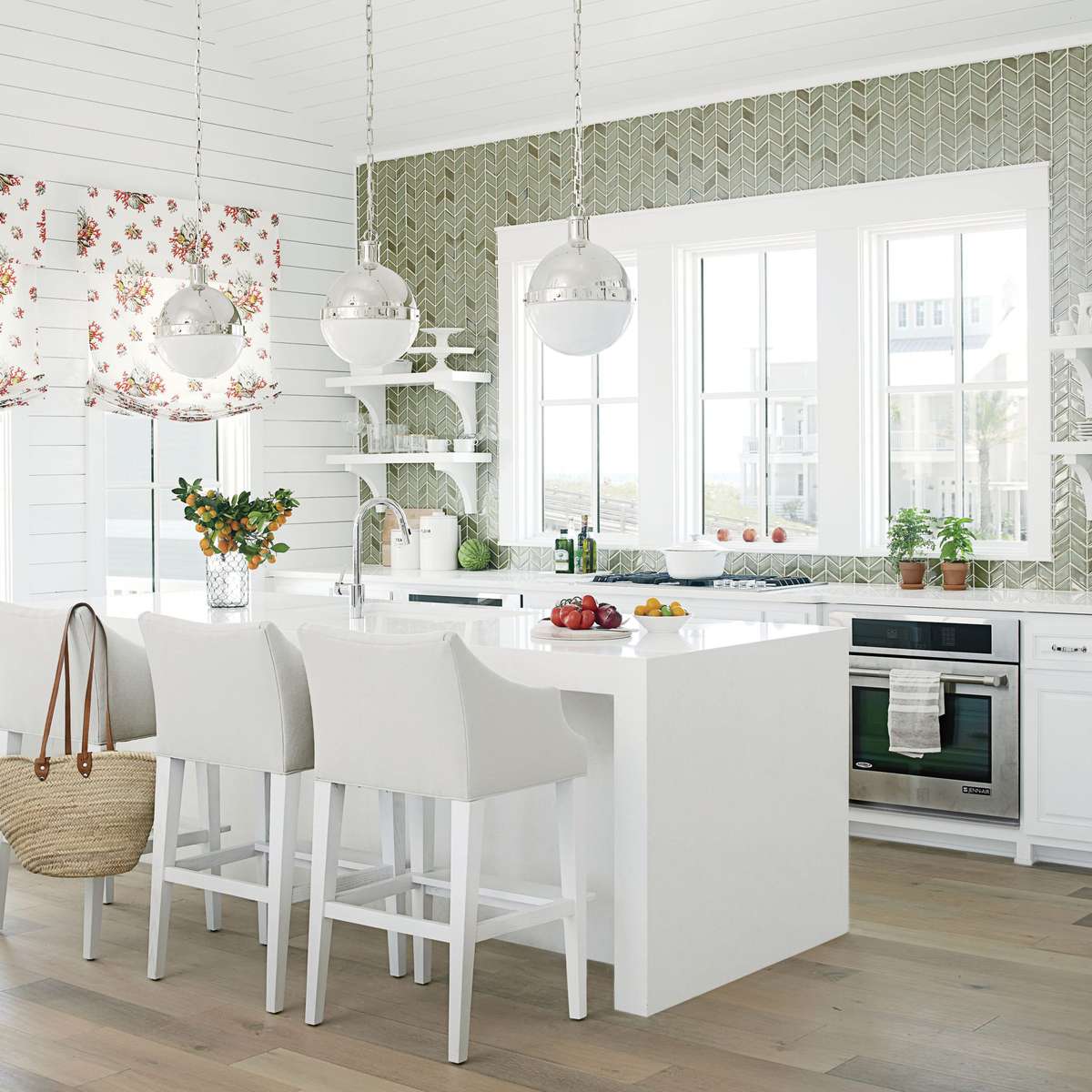 This kitchen reminds us of one of those movies with a star-studded ensemble cast that make it shine start-to-finish. Here, the stars are all manner of smart ideas: olive ceramic tile backsplash climbing all the way to the ceiling, big windows, and more.
