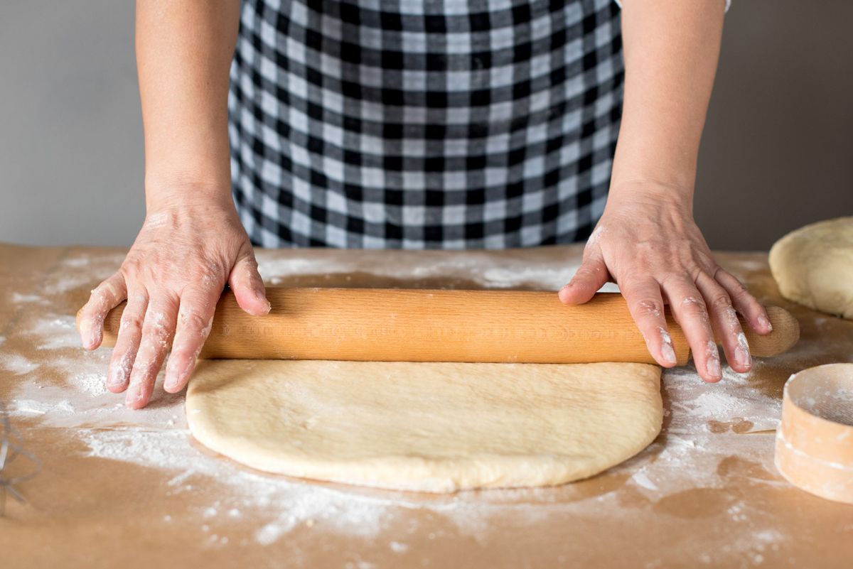 Woman Rolling Out Dough