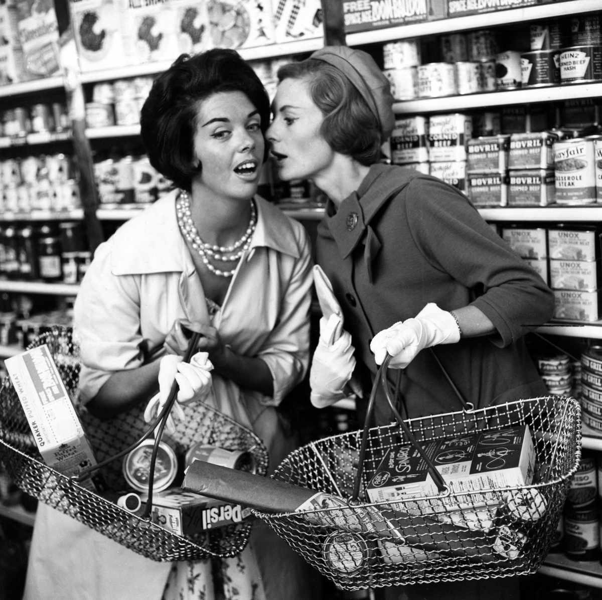 women gossiping in supermarket