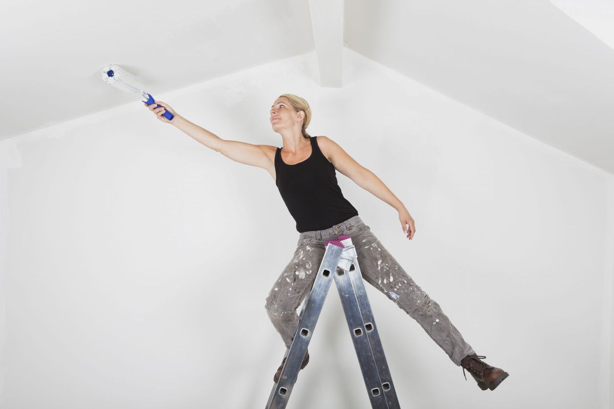 Woman Painting Ceiling
