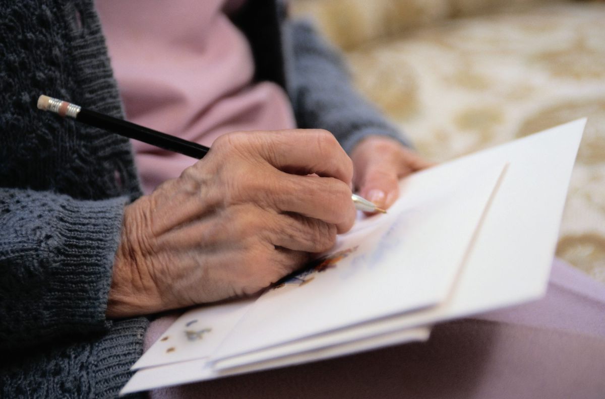 Older Woman Writing Letter