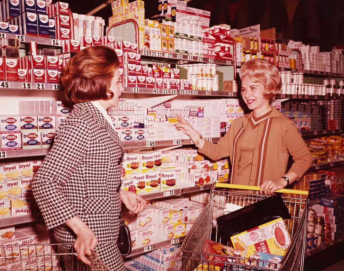 women talking in grocery store