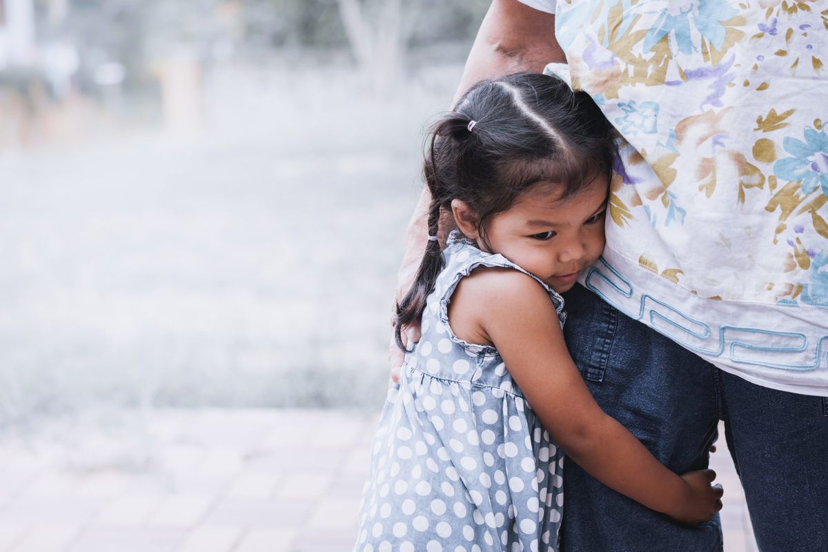Little Girl Hugging Parent