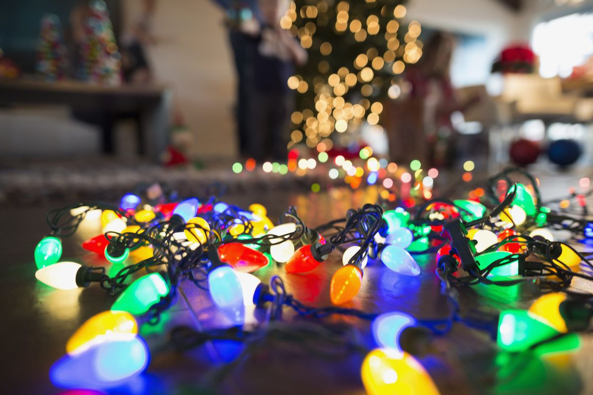 Close up multicolor Christmas string lights on floor