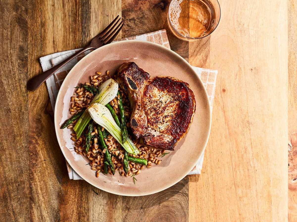 Pork Chops with Spring Onions, Farro, and Asparagus