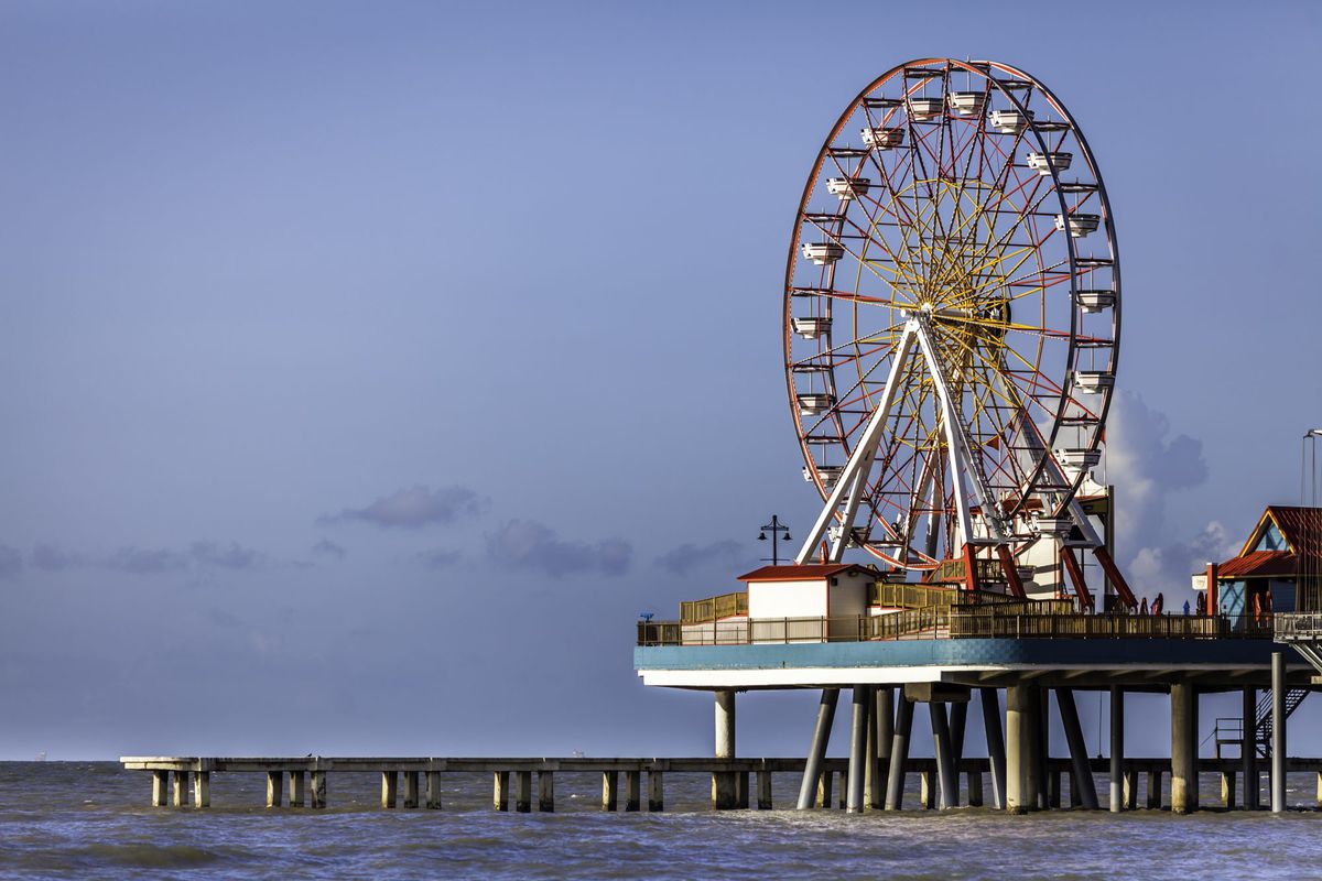 It might be the 32 miles of pristine beachfront and lively Pleasure Pier amusement park that attract tourists to this Gulf Coast barrier island, but it’s the fresh Gulf seafood, storied industrial past, and quiet streets lined with pastel-colored Victoria