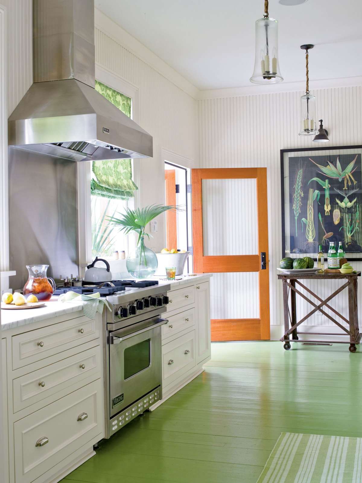 <p>The floor is painted a leafy green, which will give an even more weathered, beachy feel to the kitchen when the boards start to show through. Vintage-inspired beaded board lends even more character to the room while the white keeps it fresh and crisp.</p>
                            