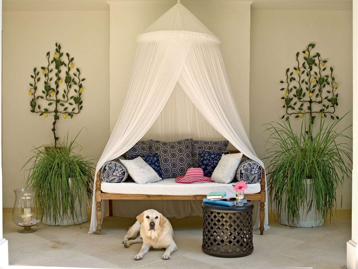 <p>Create an island-inspired retreat on your patio with fabric netting draped around a comfy outdoor sofa. Plenty of pillows make the space extra-comfy.</p>
                            