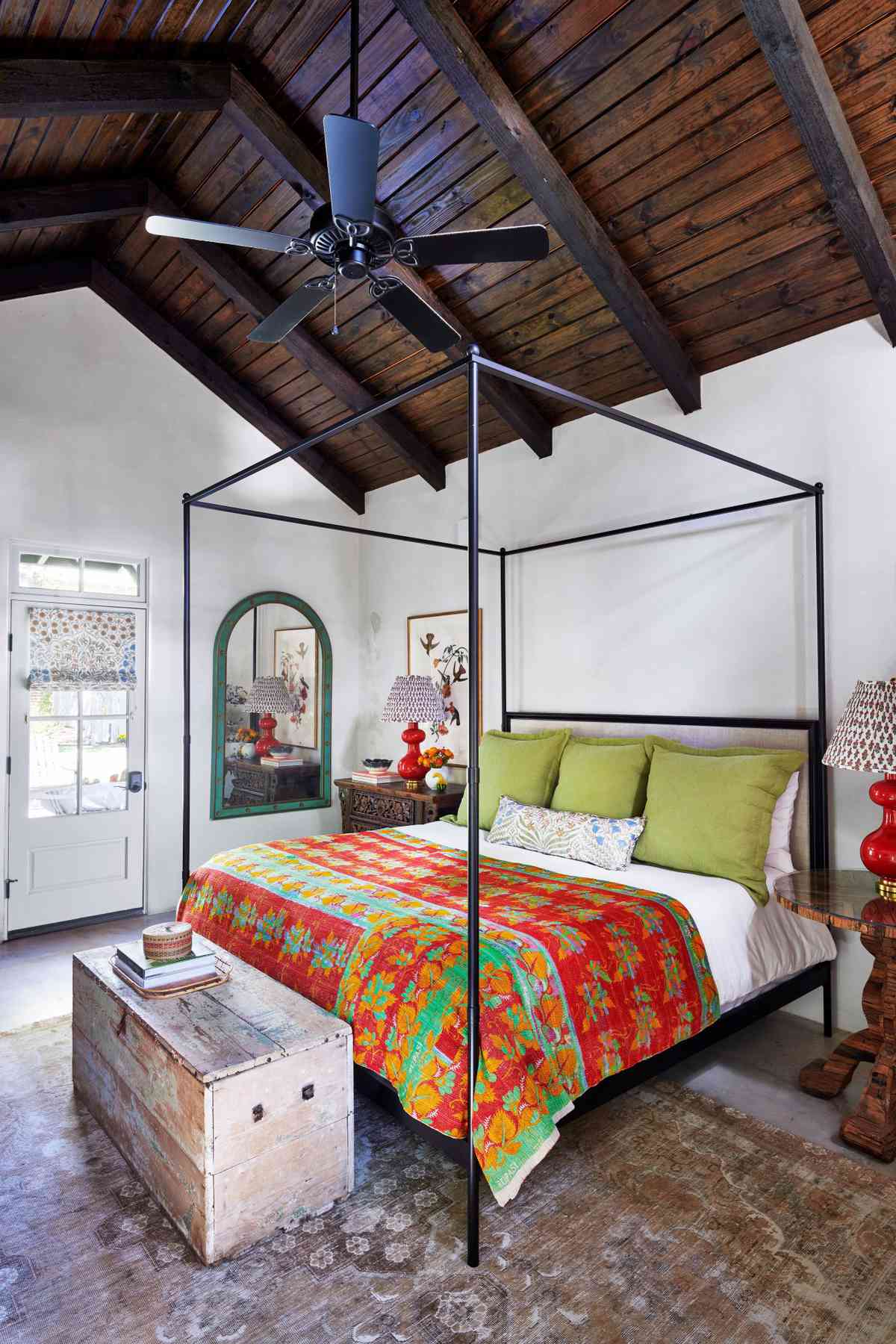 Bedroom with canopy bed and vaulted wood clad ceiling